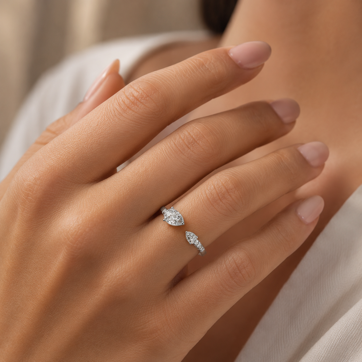 Woman wearing 925 silver pear shape diamond ring elegant minimal luxury