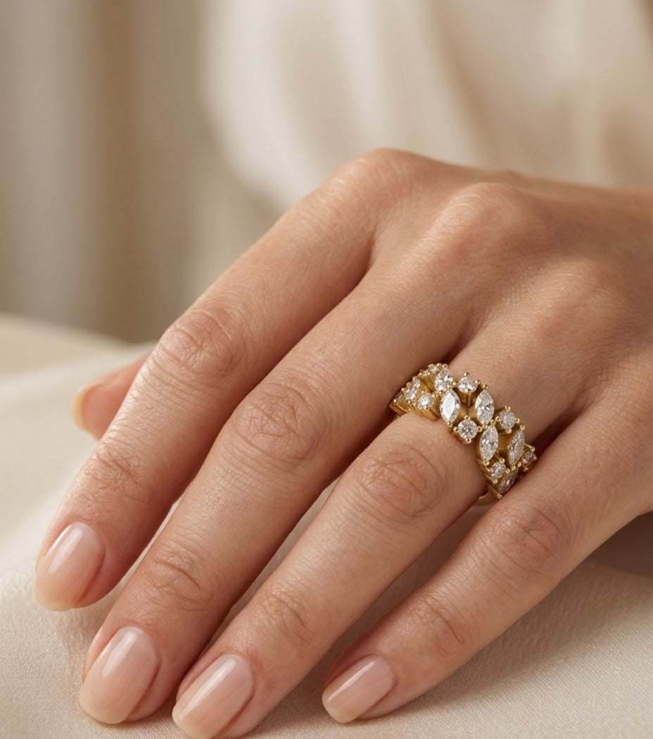 gold-marquise-round-diamond-engagement-ring-on-finger