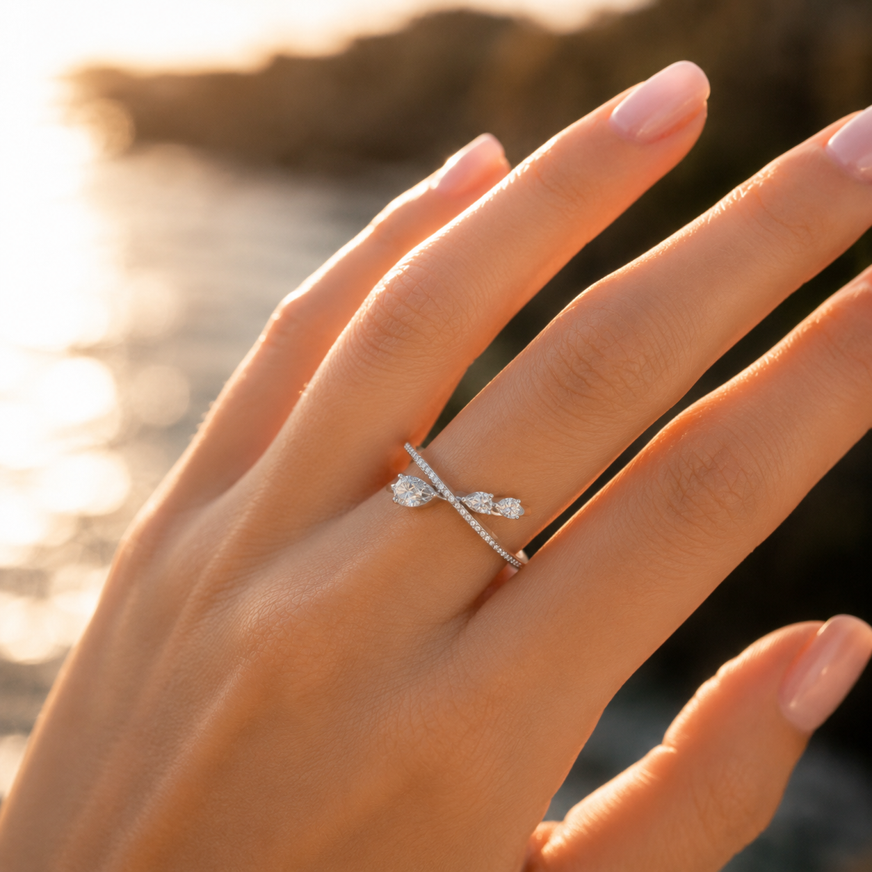 Women wearing sterling silver pear cut diamond cross ring
